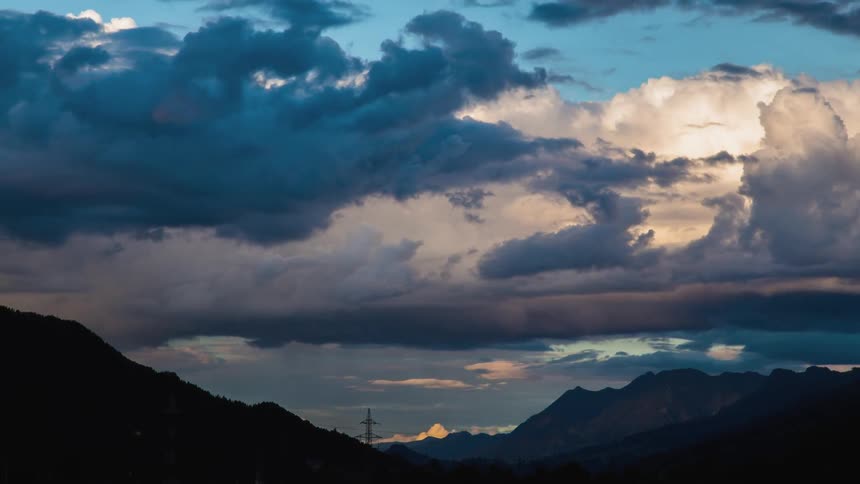 The passing of clouds over a mountainous region