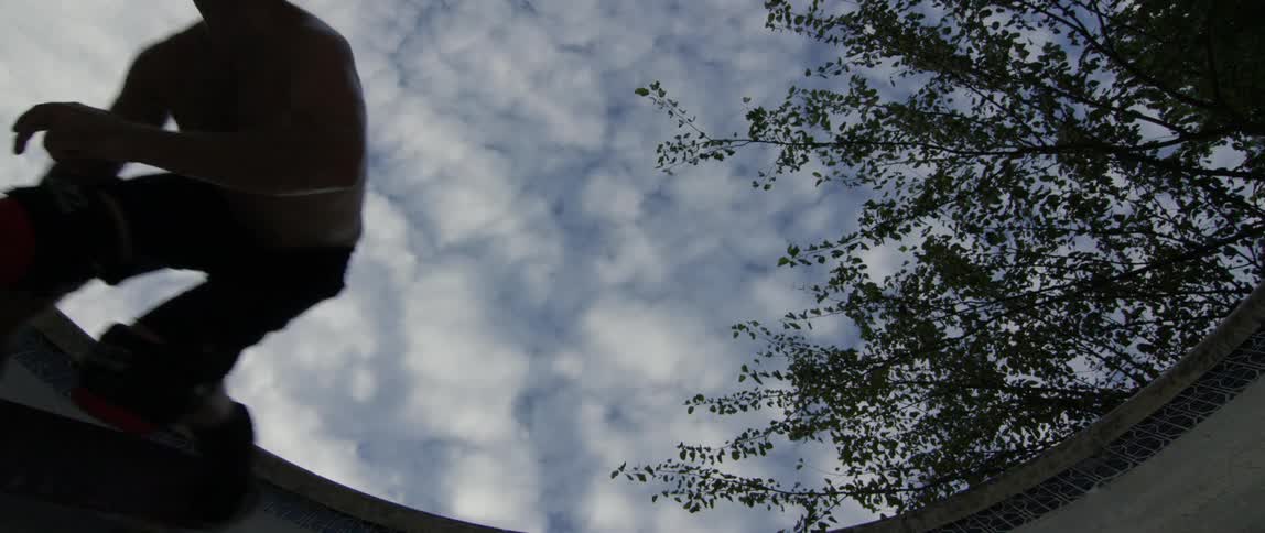 Guy skateboarding against sky
