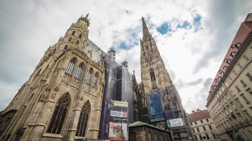 A time lapsed high up view of rotating architectural castle buildings