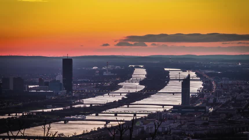 Cloud run across the orange sky above the downtown