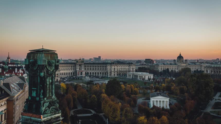 Timelapse of a citys buildings and park at dusk