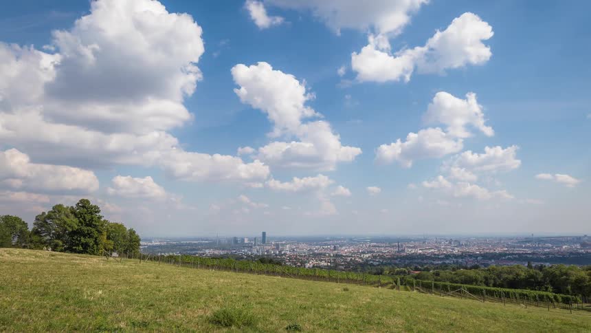 Clouds build and change over a large city