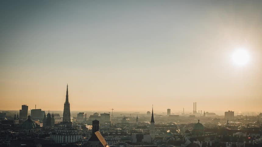 The sun over a city full of old architecture