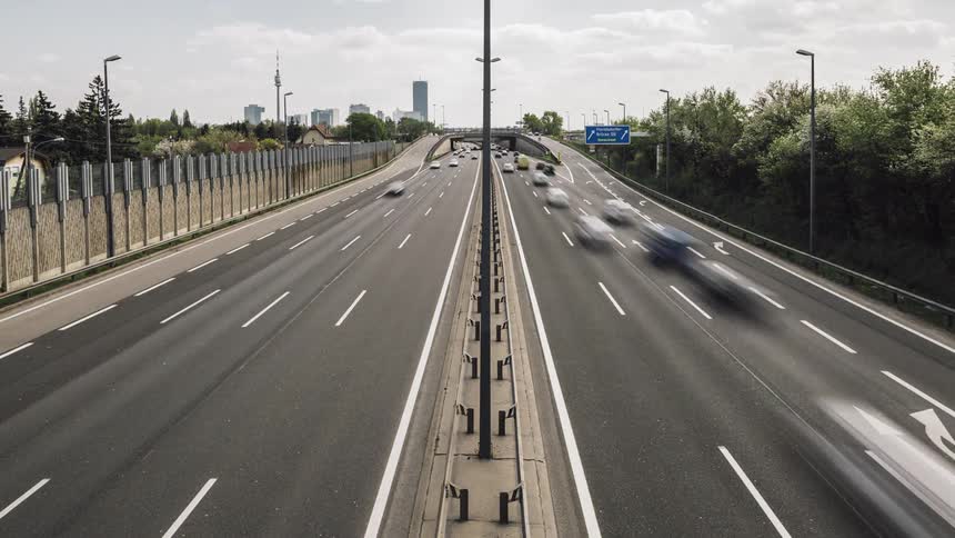 Time lapse of a city with cars driving down the freeway