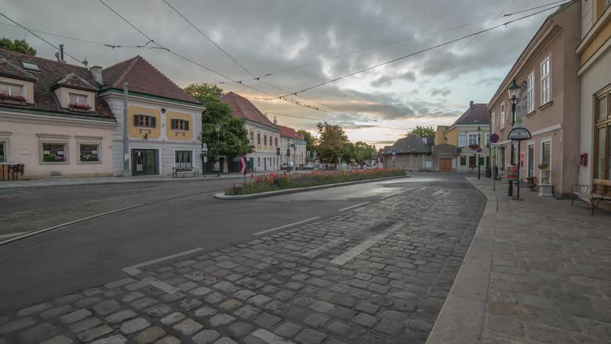 Vehicles driving through a picturesque village
