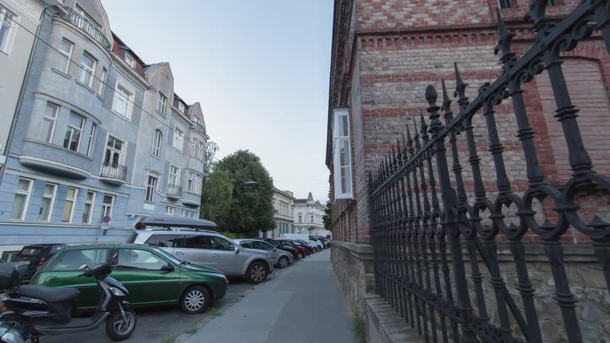 Cars park on a street