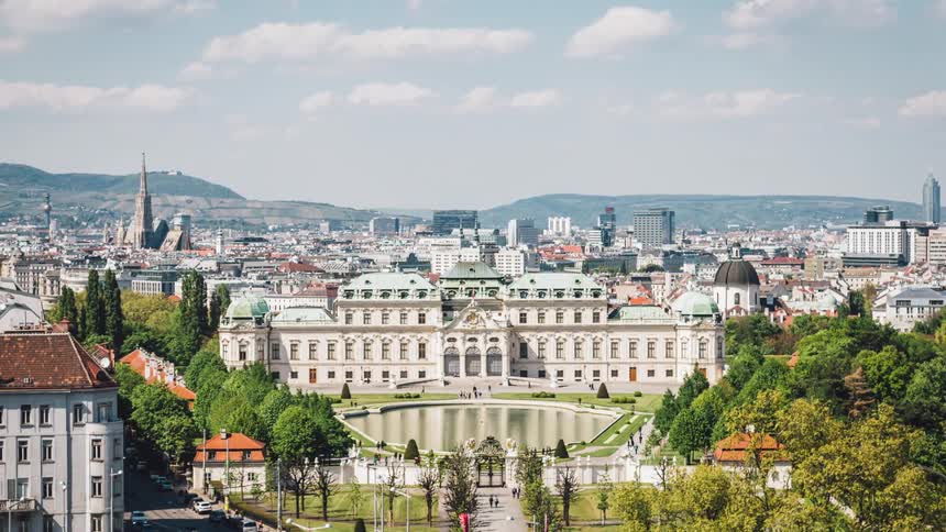 Aerial view of a palace in the middle of a city