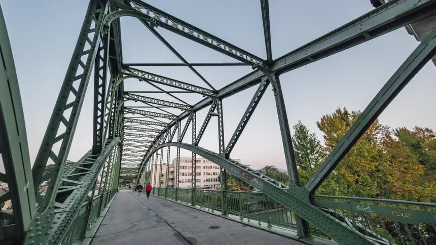 People walk across the bridge