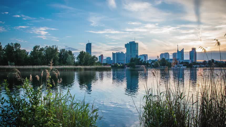 A body of water on the outskirts of a city