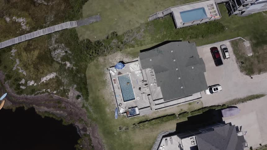 Birds eye view of a house with a swimming pool