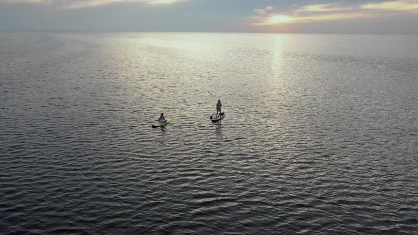 Two people that are kayaking on a lake