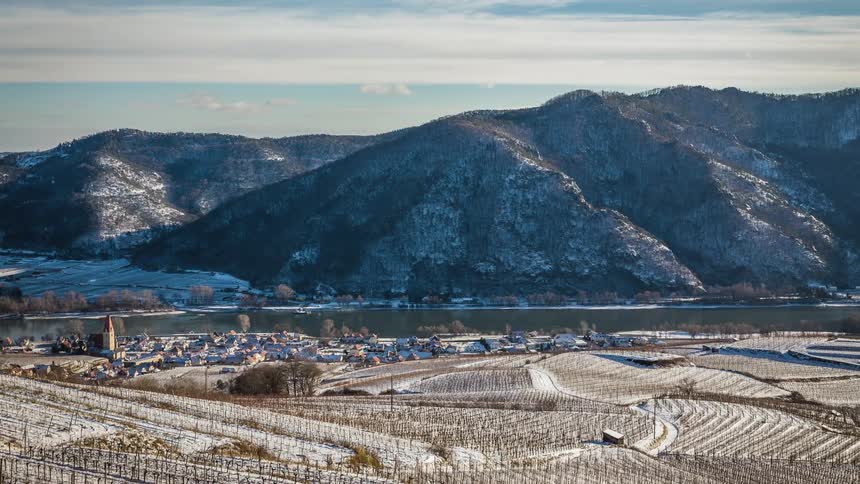 A countryside in front of the mountains