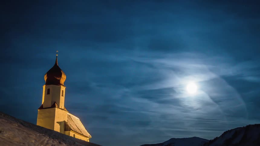 A church with the sky and the moon in the background