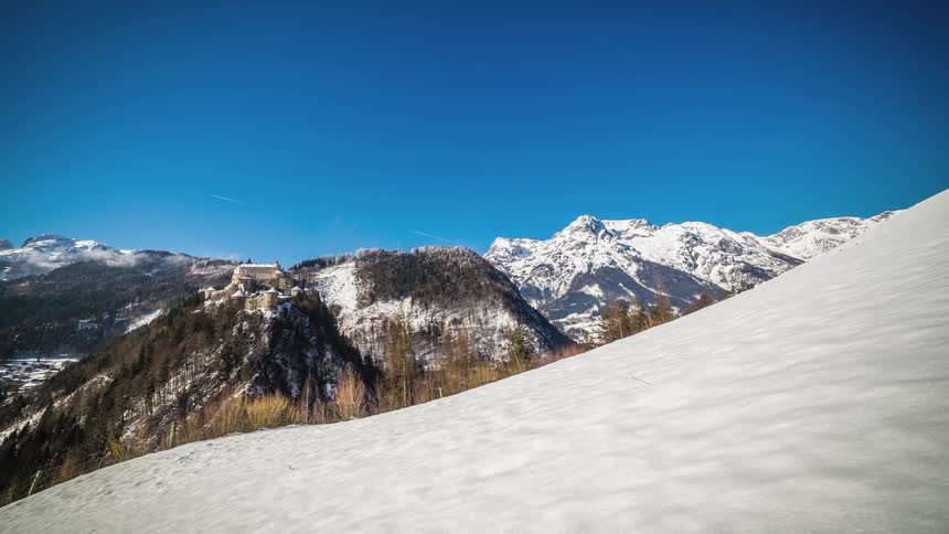 Snow covered mountains under a blue sky