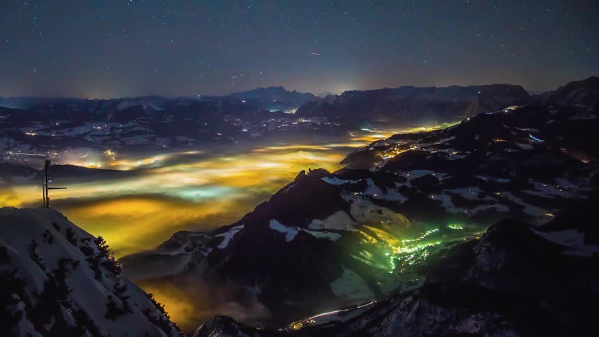 A time lapse of a city in a mountain