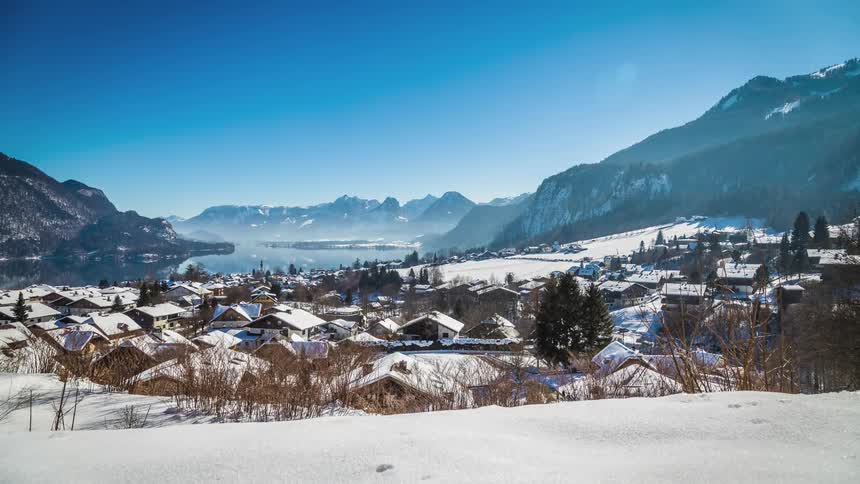 A small town sits nestled in a mountain valley