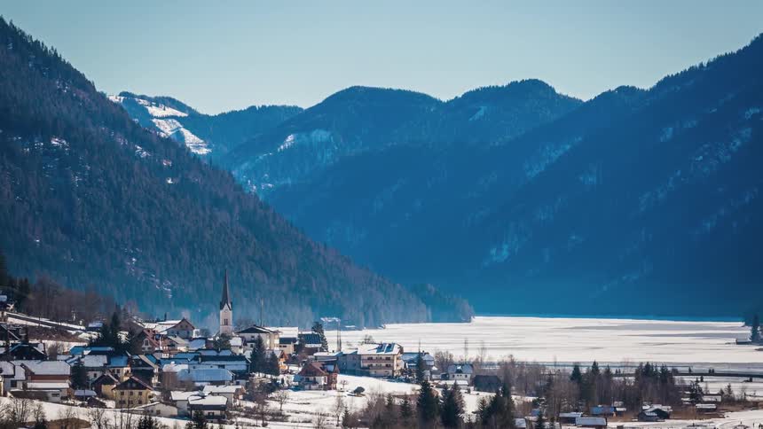 A time lapse of hallstatt austria in winter with the lake and mountains in the background