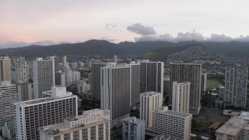 The skyline of a city near the mountain during the day