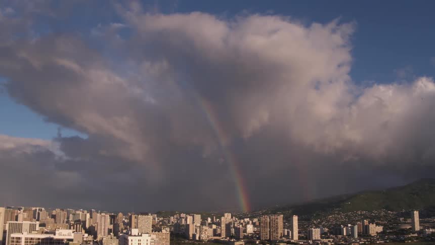 A rainbow through the clouds