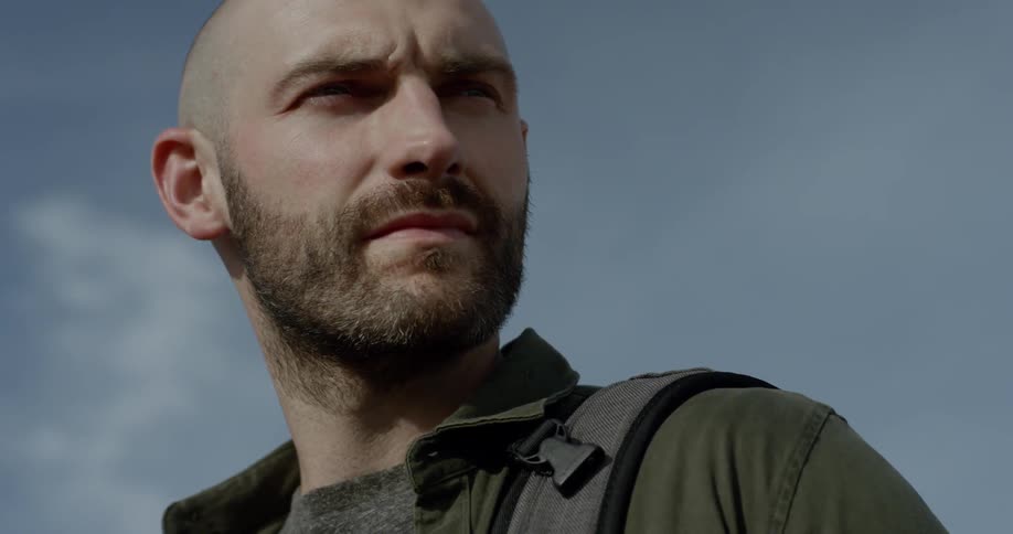 Face of a young bearded man