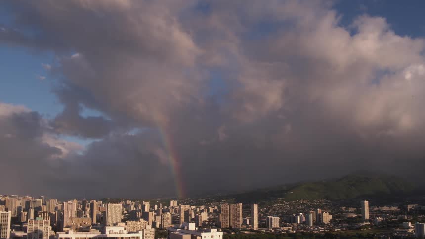 Rainbow in the clouds over a downtown