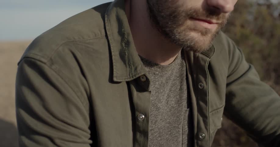 A man looking towards the ground