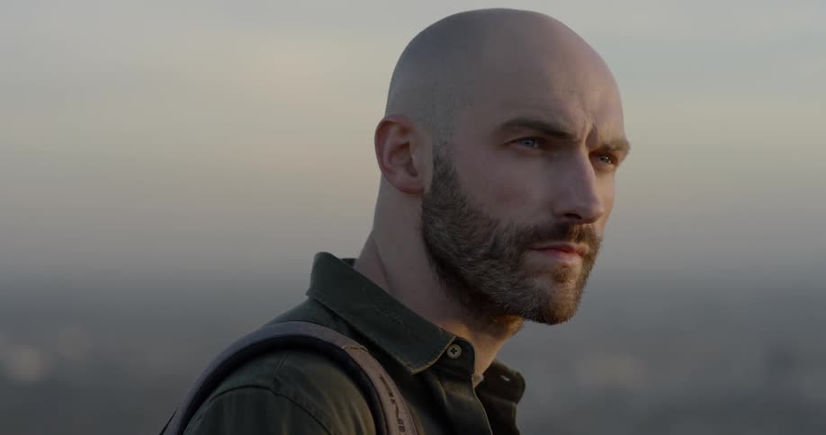 Face of a young bearded man