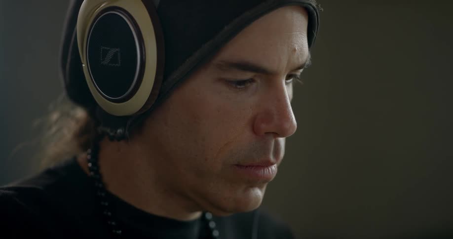 Man wearing headphones studies