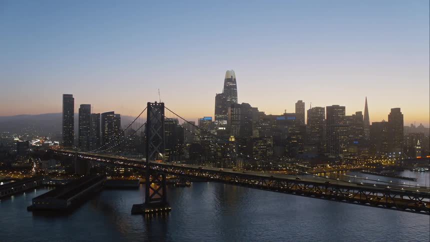 Aerial shot of a city skyline at dusk