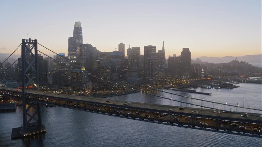 A bridge over a river in a large city