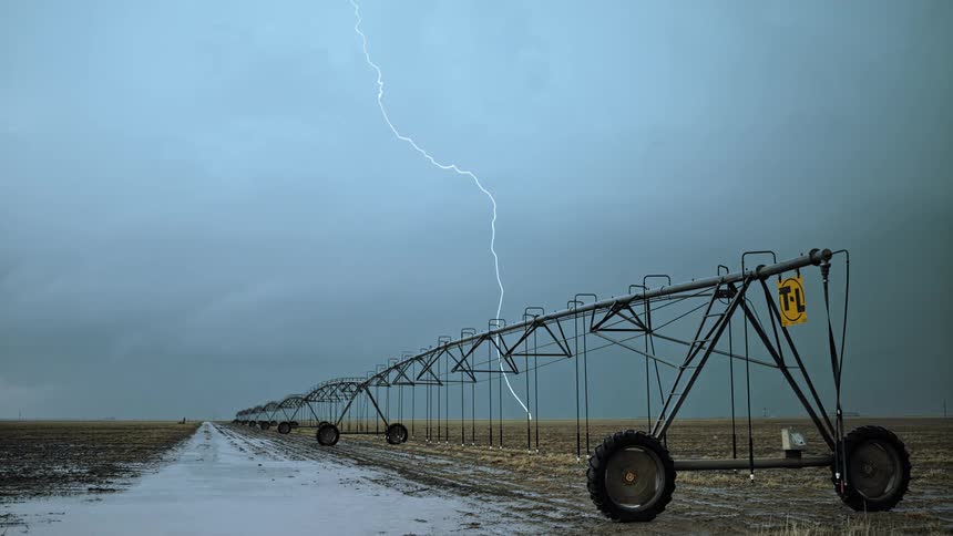 Grassland with the sky and lightning in the background