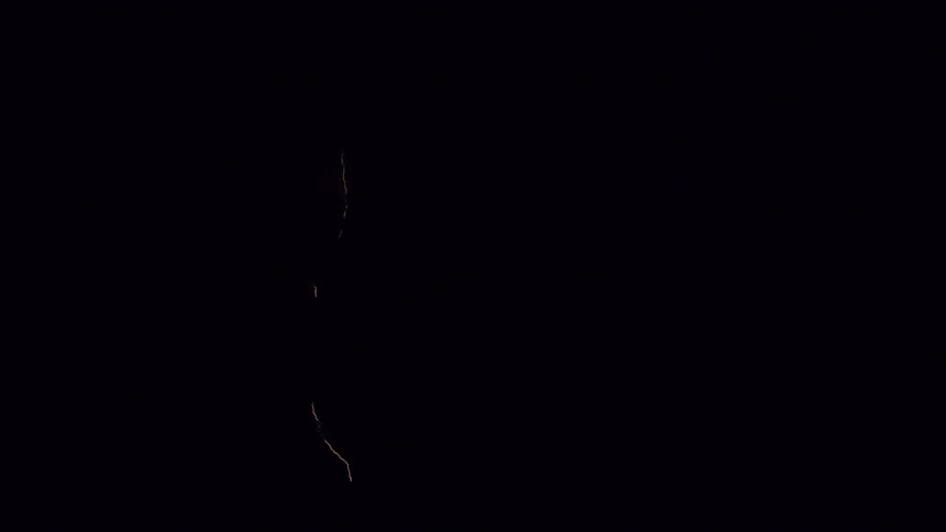 Lightning flashing in the night sky