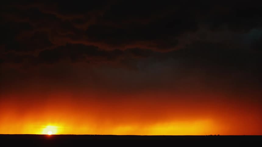 The fire and lightning are barriers against the black night sky