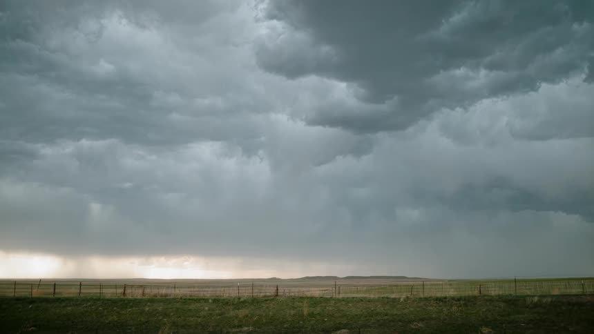 Far away lightning strikes from the clouded sky
