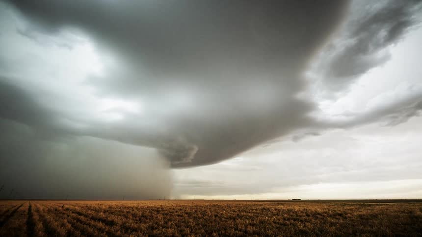 Clouds roil across sky as storm front moves across crop lands