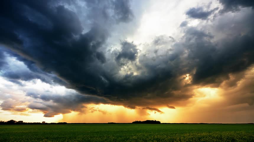 Dark heavy clouds move over the grass plains