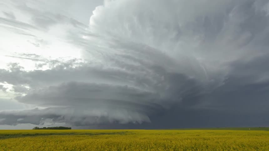 A storm moves over grasslands
