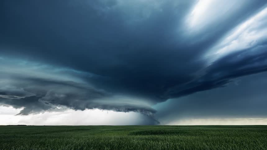 A tornado gathers pace in rural farmland