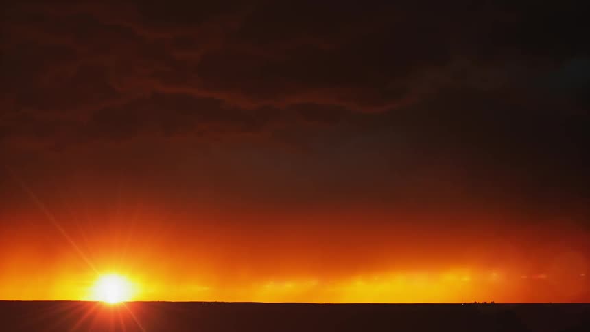A sun setting during a storm