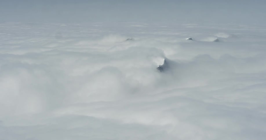 Clouds slowly moving across mountain tops