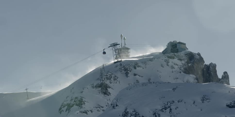 A ski lift pulls to the top