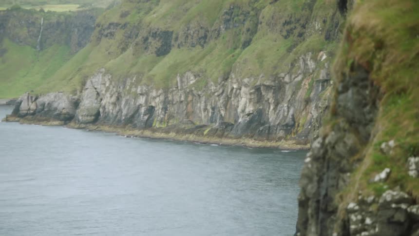 Water surrounds a promontory in the ocean