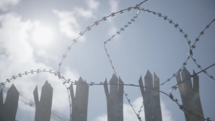 Views of barbed wire on a fence