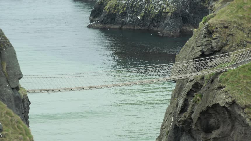 A footbridge runs across a river