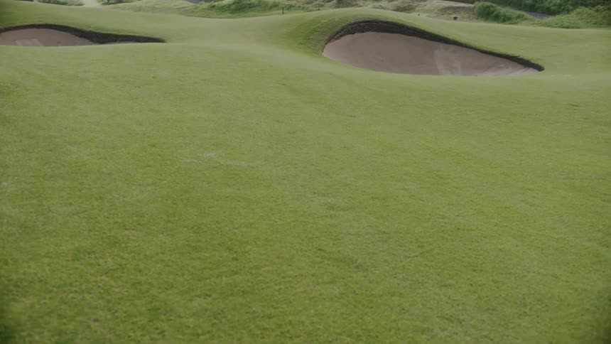 Deep sand pits on a green golf course