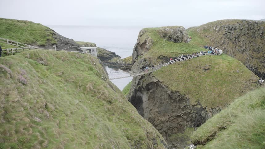 Now a lot of people are walking across the suspended bridge above the cliff and the ocean