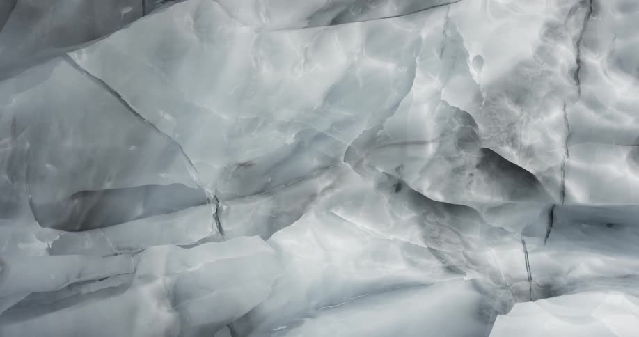 Glacial ice formations reflect the midday sun