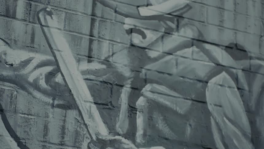 Mural of man holding staff