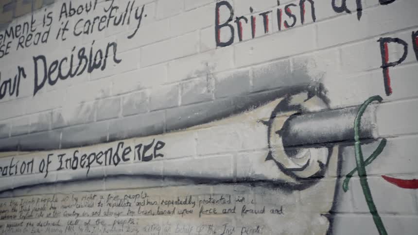 A mural on the side of a brick structure