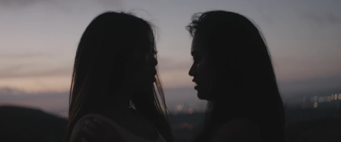 Two women staring into each others eyes